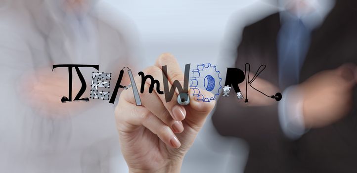 businessman hand drawing design graphic word TEAMWORK as concept 
