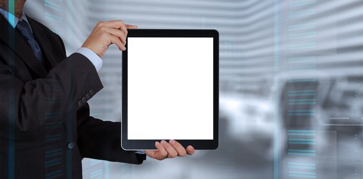 businessman success working with blank tablet computer his board room background as concept 