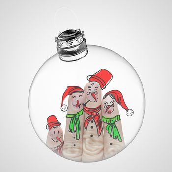 A lovely family hand drawn and finger of snowmen inside of christmas ball