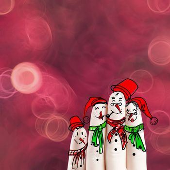 A lovely family hand drawn and finger of snowmen on flowers nature background as concept idea 