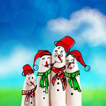 A lovely family hand drawn and finger of snowmen on nature background as concept idea