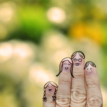 happy finger family with blurred nature background