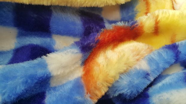 Closeup view of colorful soft blanket for winter season