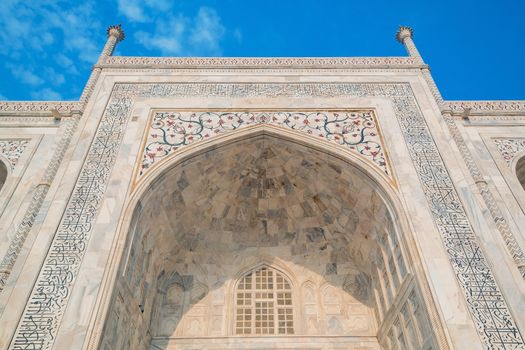 Taj Mahal on a sunny day. An ivory-white marble mausoleum on the south bank of the Yamuna river in Agra, Uttar Pradesh, India. One of the seven wonders of the world.