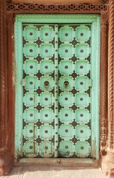 Antique rustic ancient wooden door. Architectural element.