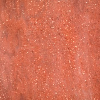 Red rough stone texture background. Material construction and architectural detail.