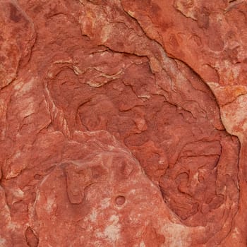 Red rough stone texture background. Material construction and architectural detail.