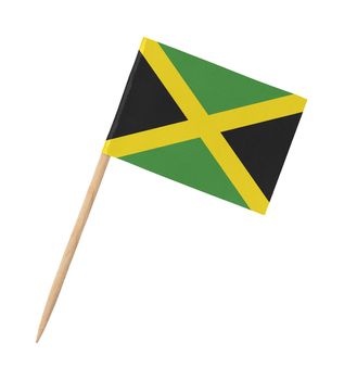 Small paper Jamaican flag on wooden stick, isolated on white