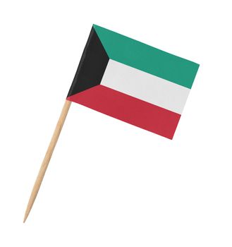 Small paper Kuwaiti flag on wooden stick, isolated on white