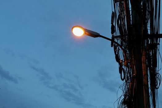 Street lights mounted on poles at evening time
