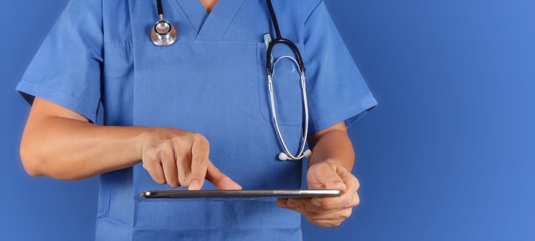 Doctor working with tablet computeron blue  background 