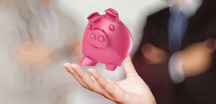 businessman hand shows piggy bank as concept 