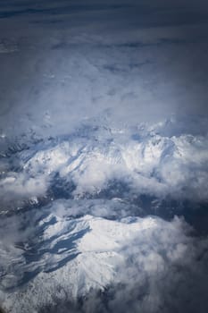 Snowy mountains in the Italian alps. Aerial, high altitude view.