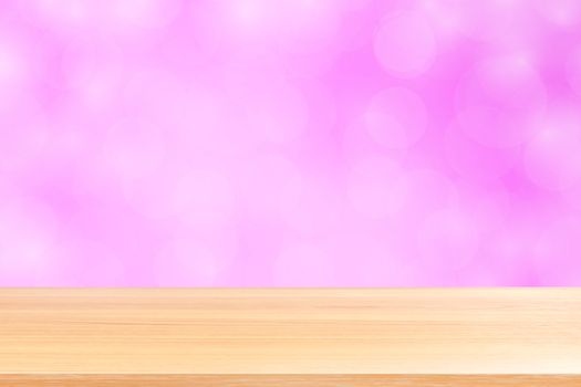empty wood table floors on blurred bokeh soft pink gradient background, wooden plank empty on pink bokeh colorful light shade, colorful bokeh lights gradient soft for banner advertising products