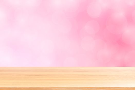 empty wood table floors on blurred bokeh soft pink gradient background, wooden plank empty on pink bokeh colorful light shade, colorful bokeh lights gradient soft for banner advertising products