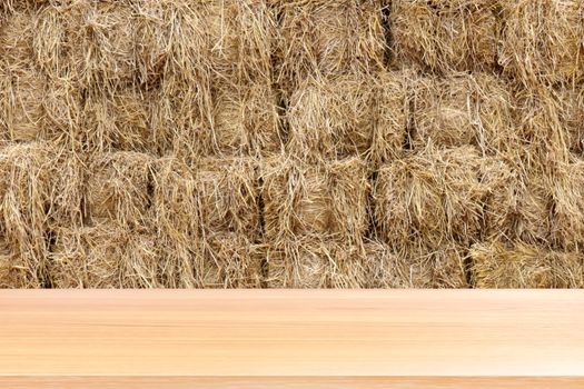 wood plank on straw, empty wood table floors on straw block cube background, wood table board empty front straw cube wall backdrop, wooden plank blank over hay dry straw yellow brown color