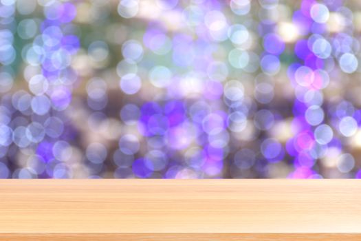 wood plank on bokeh purple lighting vivid colorful abstract background, empty wood table floors lighting decoration in shopping mall, wood table board empty front violet bokeh glitter interior light