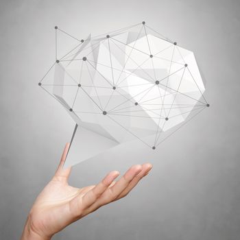 hand showing low poly geometric speech bubble with social media structure on white background