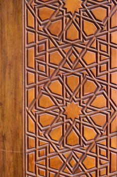 Geometrical pattern on a wooden door at a the Sehzade Mosque in Istanbul, Turkey. Islamic art, woodwork, detail close up.