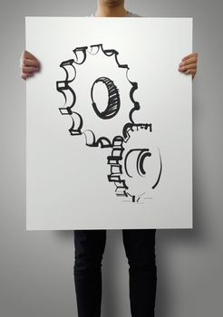 man showing poster of gear to success concept