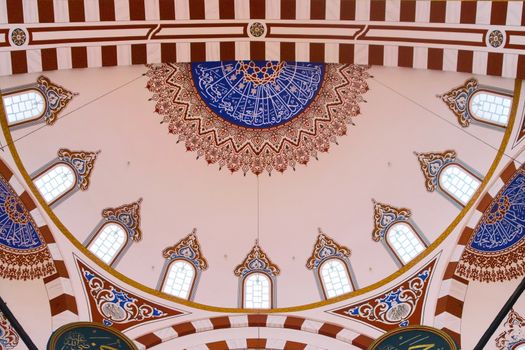 Islamic art decoration at the Sehzade Mosque in Istanbul, Turkey. Interior view of the main dome.