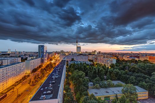Dark clouds over downtown Berlin at sunset with the Television Tower in the back