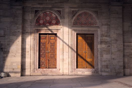 Geometrical pattern on a pair of wooden doors at the Sehzade Mosque in Istanbul, Turkey. Islamic art, woodwork, ornament detail.