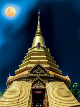 Buddhist temple at full moon night,  Buddhist holy days in July Asaha Puja Day