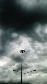 power electric pillar and dark cloud in sky