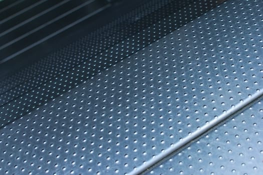 Studded steel plate flooring. Industrial background texture, high resistance material.