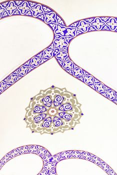 Blue and gold pattern in islamic style on a wall at Grand Bazaar of Istanbul. Close up detail.