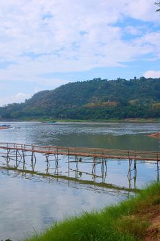 Bamboo bridge over Nam Khan river, in the confluence with Mekong River in Luang, Prabang, Laos.