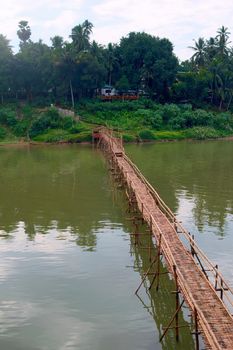 Bamboo bridge over Nam Khan river, in the confluence with Mekong River in Luang Prabang, Laos.