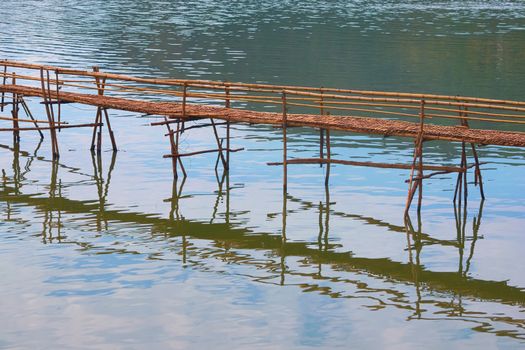 Bamboo bridge over Nam Khan river, in the confluence with Mekong River in Luang Prabang, Laos.