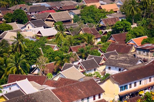 Typical east asian rooftops seen from above. Elevated view of the town of Luang Prabang, Laos, from Mt. Phou Si.