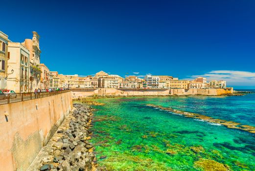 Scenic view of a promenade in Syracuse (Ortigya), Sicily, Italy. Picturesque coastline in the famous Sicilian town