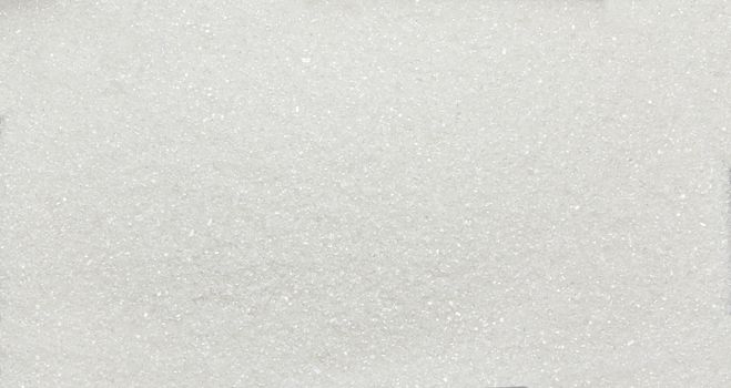Heap of white sugar crystals - texture and details, close up
