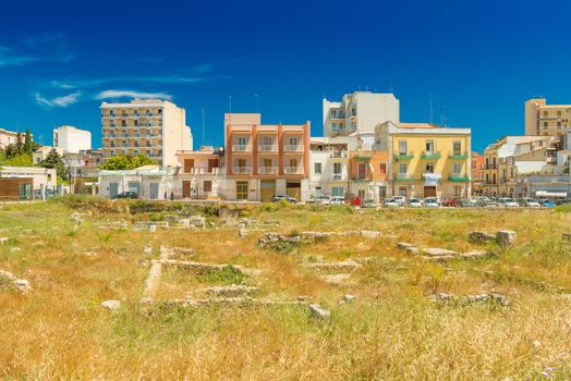 Ruins of the ancient constructions covered with grass, the central part of Syracuse, Italy