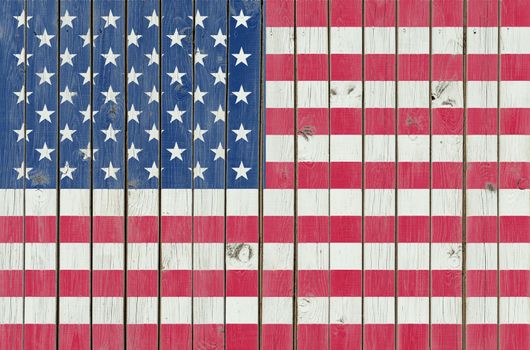USA Flag painted on the wooden fence, American background, texture of the scratched weathered wood, cracked paint