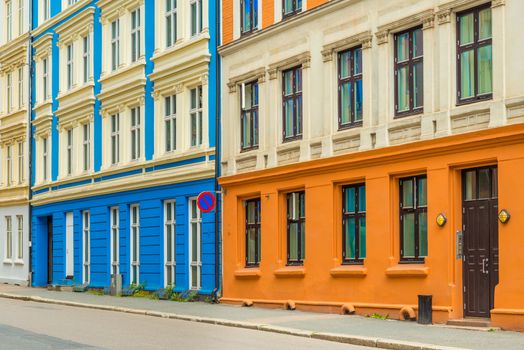 Colorful facades of residential buildings in Oslo, Norway. View of an empty street with Scandinavian architecture