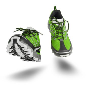 Green running sport shoes seen front, isolated on white background