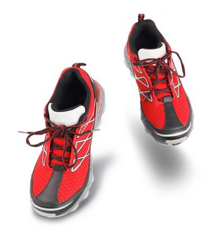 Red running sport shoes going forward, exercising concept, isolated on white background