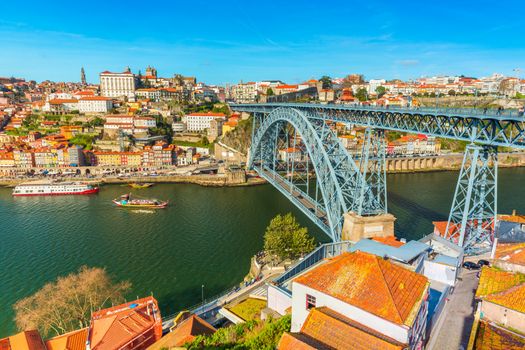 Cityscape of Porto (Oporto). View of the Dom Luis I Bridge (Ponte de Dom Luís I) and the River Douro. View from Vila Nova De Gaia, Portugal