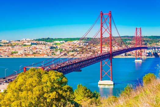 The 25th April Bridge (Ponte 25 de Abril) in Lisbon, Portugal. View from Almada