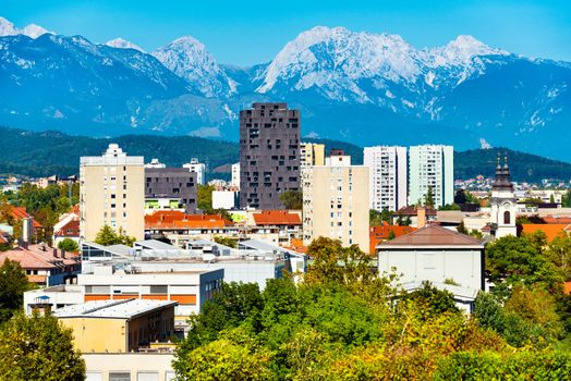 Beautiful cityscape with modern buildings and mountains in the background