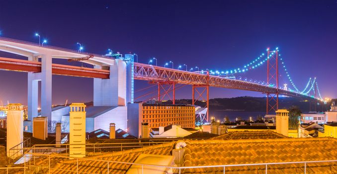 The 25 de Abril Bridge (Ponte 25 de Abril) at night, Lisbon, Portugal