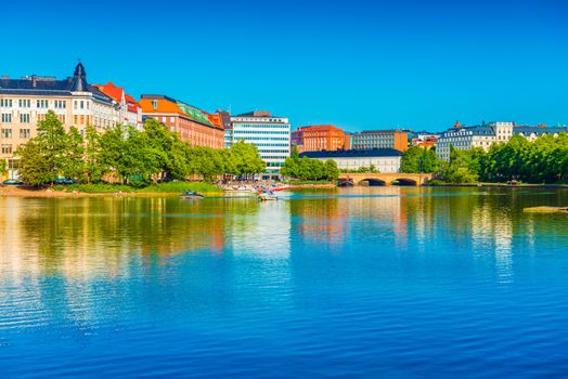 Cityscape of Helsinki mirrored in water, Finland