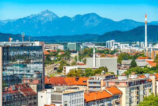 Aerial panorama of Ljubljana with modern buildings and the Alps in the background, Slovenia