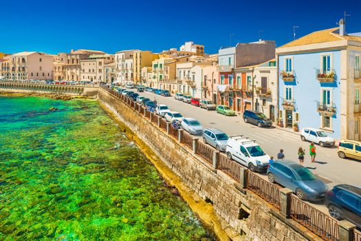 View of an embankment in Ortygia (Ortigia), Syracuse. Picturesque cityscape of an ancient historical town on Sicily, Italy