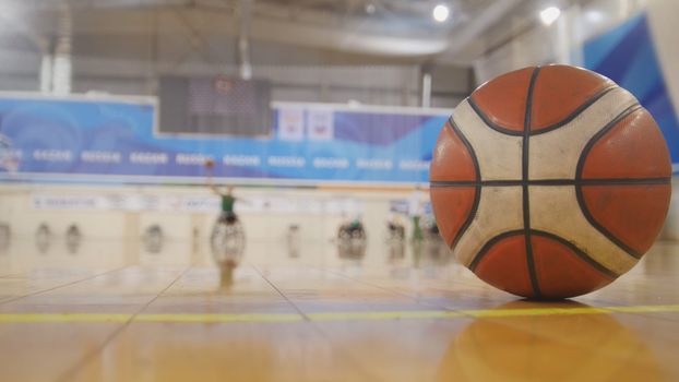 Training of disabled sportsmen - playing wheelchair basketball, wide angle